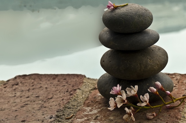 Zen rock in front of water